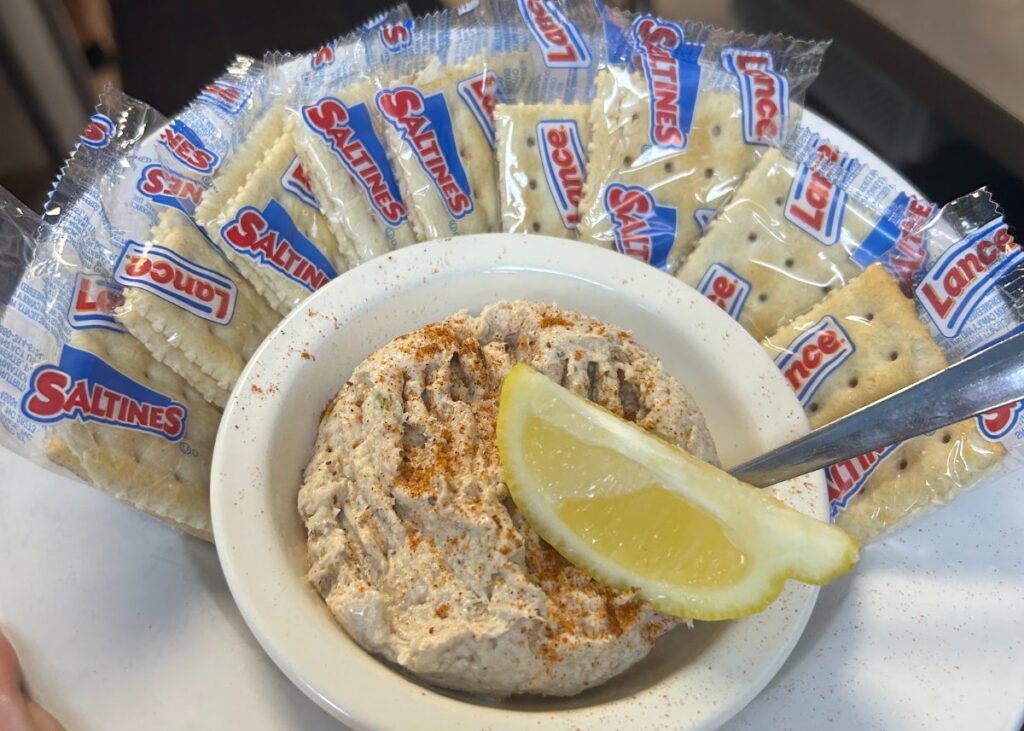 Smoked fish spread with crackers and lemon